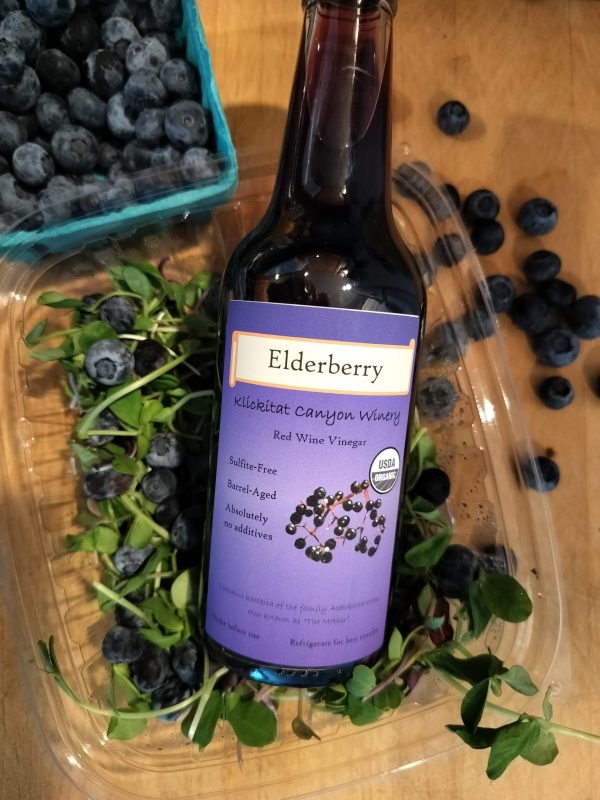 Organic Elderberry Vinegar with pea shoots and blueberry salad