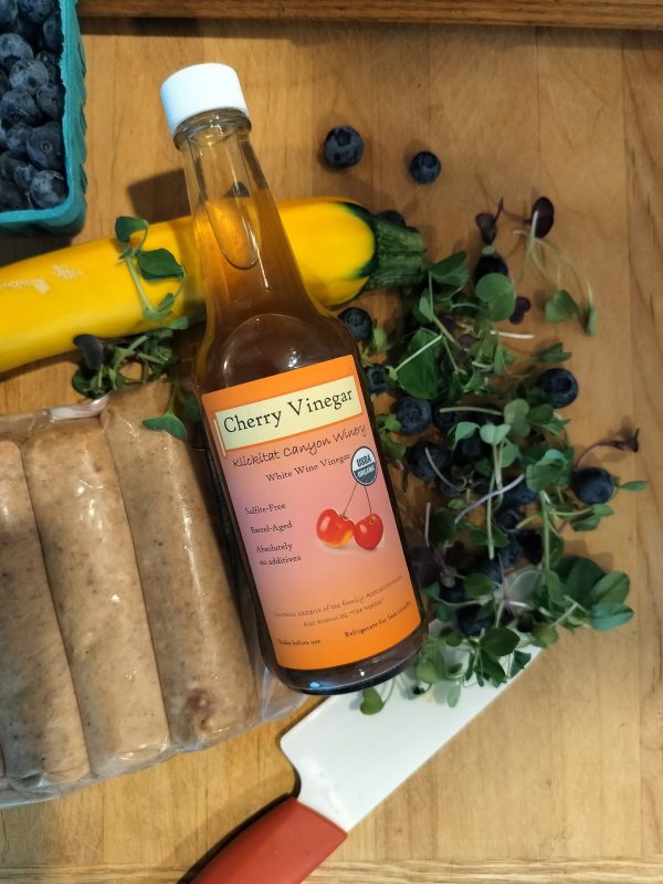 Organic Rainier Cherry Vinegar with sausages and sprouts